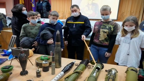 Photos show Ukrainian schoolchildren learning about explosives ahead of potential Russian invasion