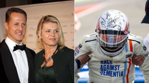 Corinna führte die Hand: Michael Schumacher unterschreibt Helm für den guten Zweck