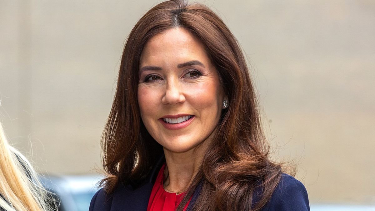 Princess Mary of Denmark dresses to impress in sleek 70s style suit and bold crimson shirt