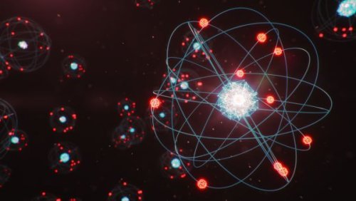 Where do electrons get energy to spin around an atom's nucleus?