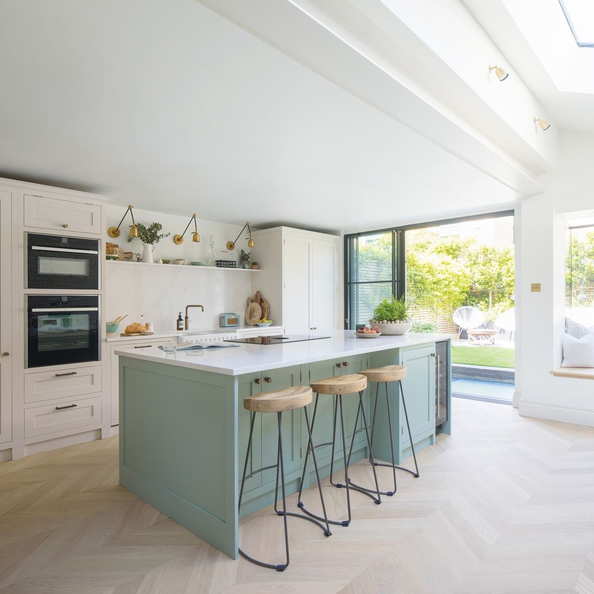 A neutral scheme with touches of soft green and pink creates balance in this beautifully renovated home
