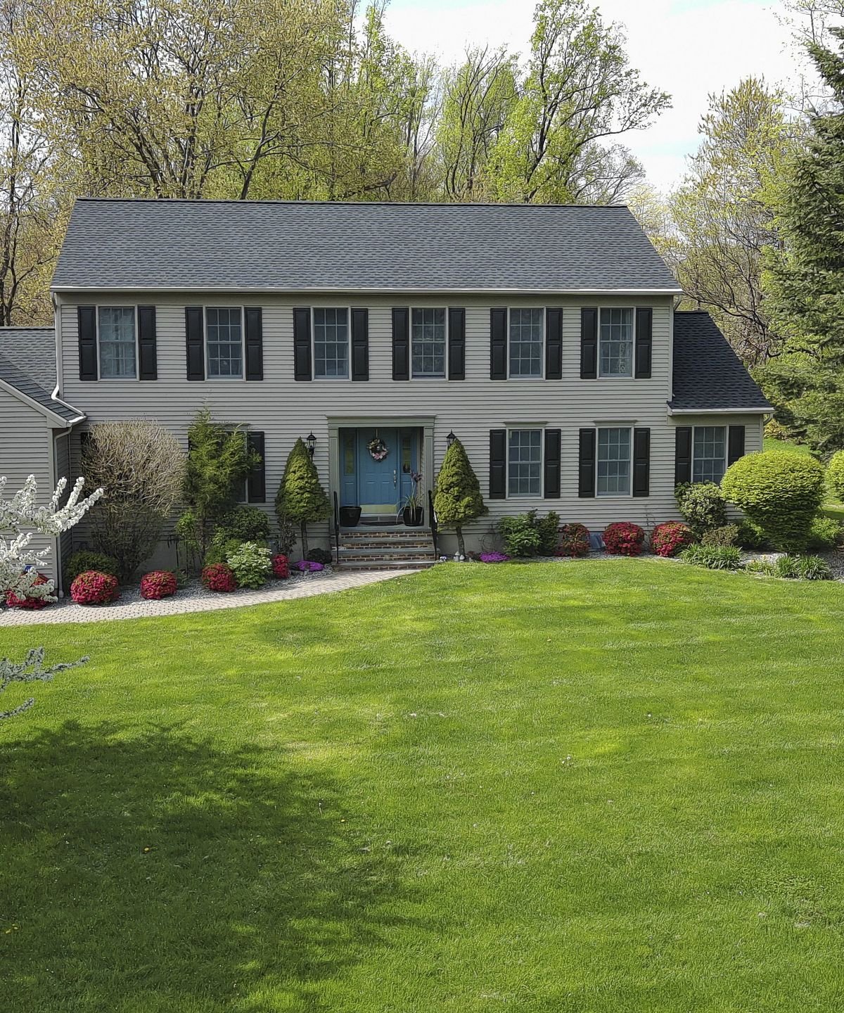 Here are 7 essential spring lawn care jobs to keep your grass lush and healthy