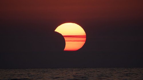 Where will the partial solar eclipse be visible in March 2025?