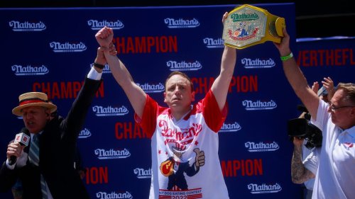 Joey Chestnut puts protestor in brief chokehold during his Nathan's Hot Dog Eating Contest victory