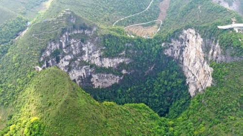 Giant sinkhole found in China has hidden forest with ancient trees growing at its floor