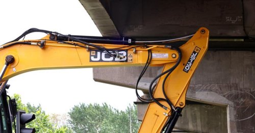 Pictures show digger stuck under A19 flyover