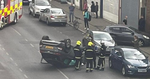 Car left on it's roof after collision on busy Middlesbrough road