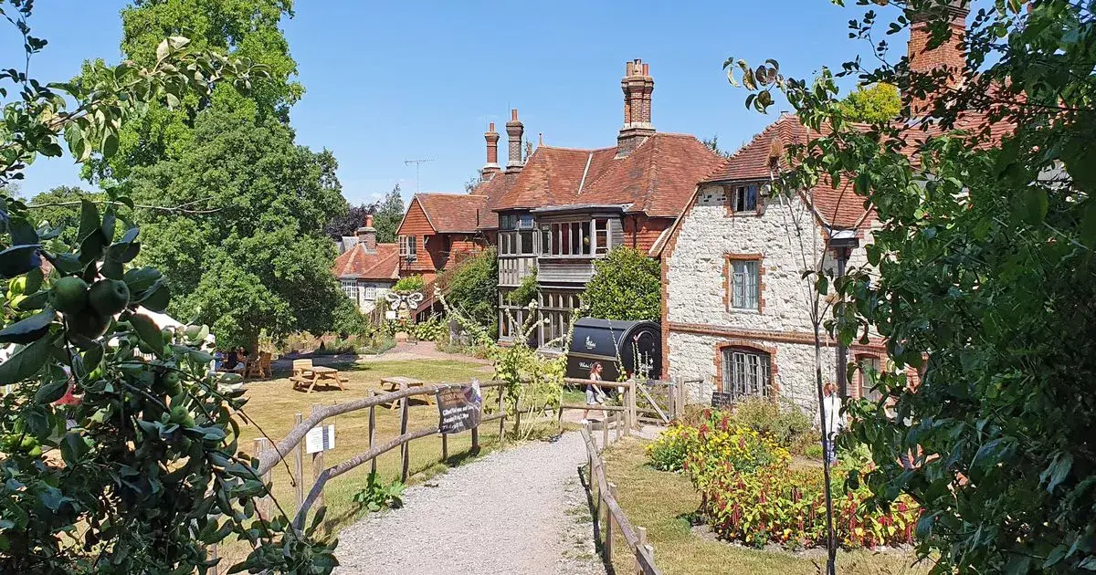 Sleepy Surrey border village with tractors and thatched cottages where the average house price is £2million