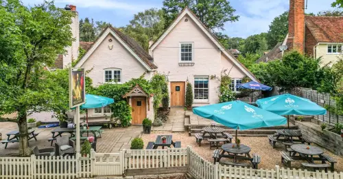 Stunning country pub for sale in fairy tale village in the Surrey Hills