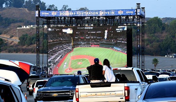 Fans look on a giant screen during game one of the World Series...