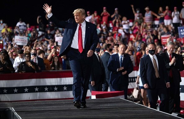 US President Donald Trump waves at the end of a Make America Great...