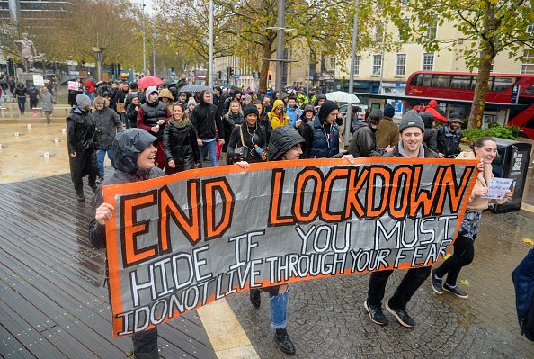 Protesters march during the anti-lockdown protest on November 14,...