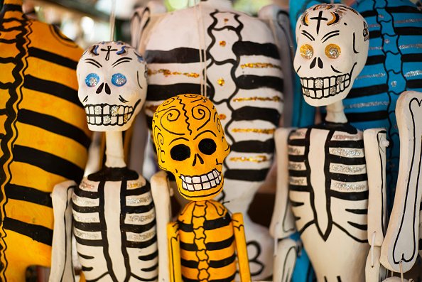 Colorful artisan skeletons, a popular Mexican art created through a...