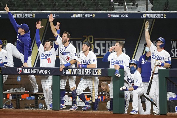 The Los Angeles Dodgers celebrate a runs scored by Mookie Betts ,...