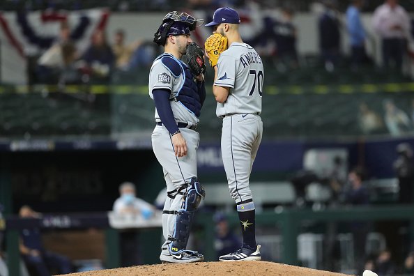 Mike Zunino and Nick Anderson of the Tampa Bay Rays meet on the mound...