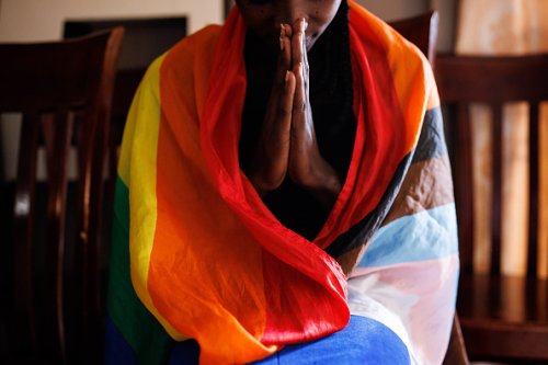 A member of the LGBTQ community prays during an evangelical church A member of the LGBTQ community prays during an evangelical church