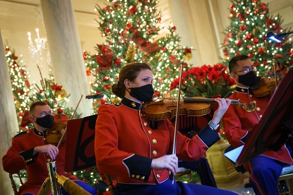 A military band plays Christmas music in the Grand Foyer