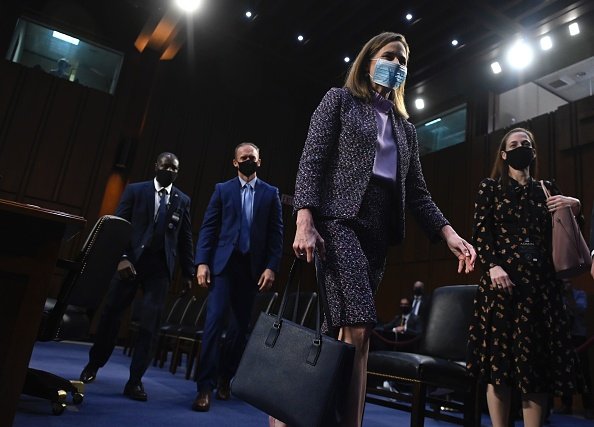 Supreme Court nominee Judge Amy Coney Barrett leaves after testifying...