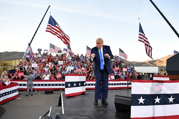 President Donald Trump dances at the end of a rally at Carson City...