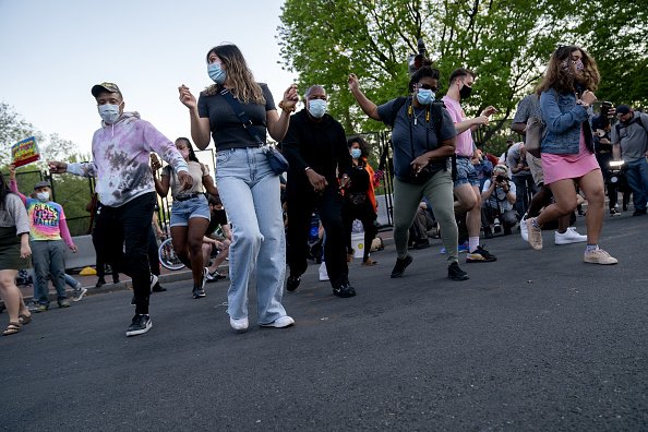 Demonstrators dance in D.C.
