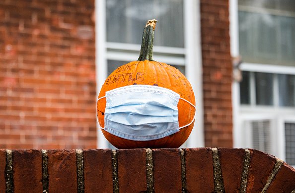 A pumpkin with a face mask is seen at Governors Island’s annual...