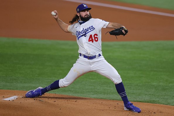 Tony Gonsolin of the Los Angeles Dodgers delivers the pitch against...