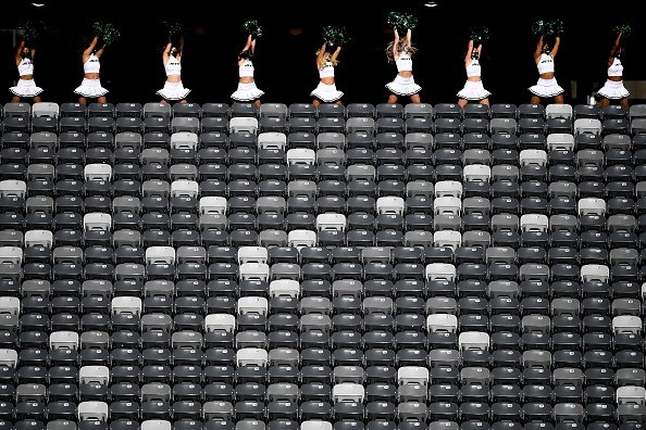New York Jets Flight Crew cheerleaders perform from the concourse in...