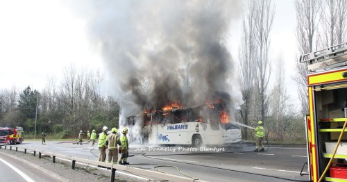 Busy Blantyre road closed in both directions after bus bursts into flames