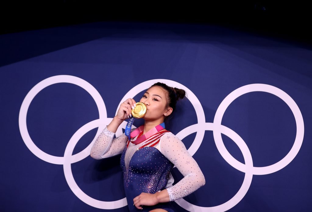 Gymnastics-USA’s Lee taking gold home to her father and Hmong community