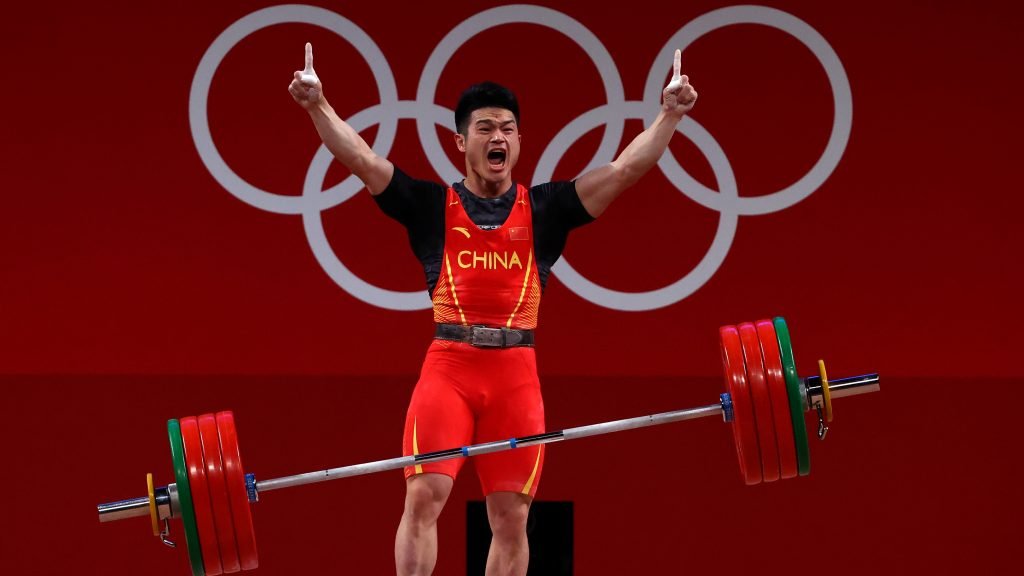Olympics-Weightlifting-China’s Shi breaks world record to win gold in 73kg