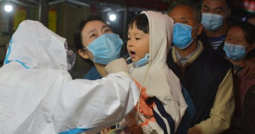 China fires 2 health officials after new coronavirus outbreak in northern city