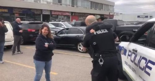 COVID-19: Peel police officer accuses Global News journalist of agitating protesters, hugs attendees