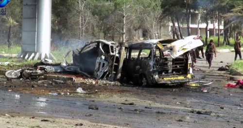 Bomb blast on bus convoy kills at least 100 in Syria