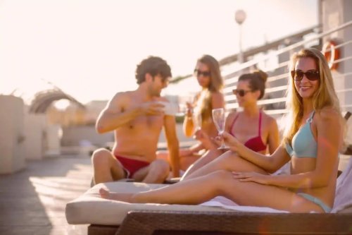 Joke — Beautiful Women Surround a Man on the Beach