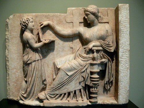 Ancient Greek Statue of Woman Using “Laptop” Sparks Conspiracy Theories