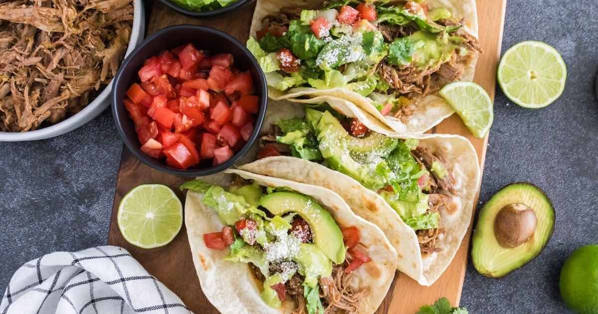 Slow Cooker Pulled Pork Tacos with Avocado Lime Crema