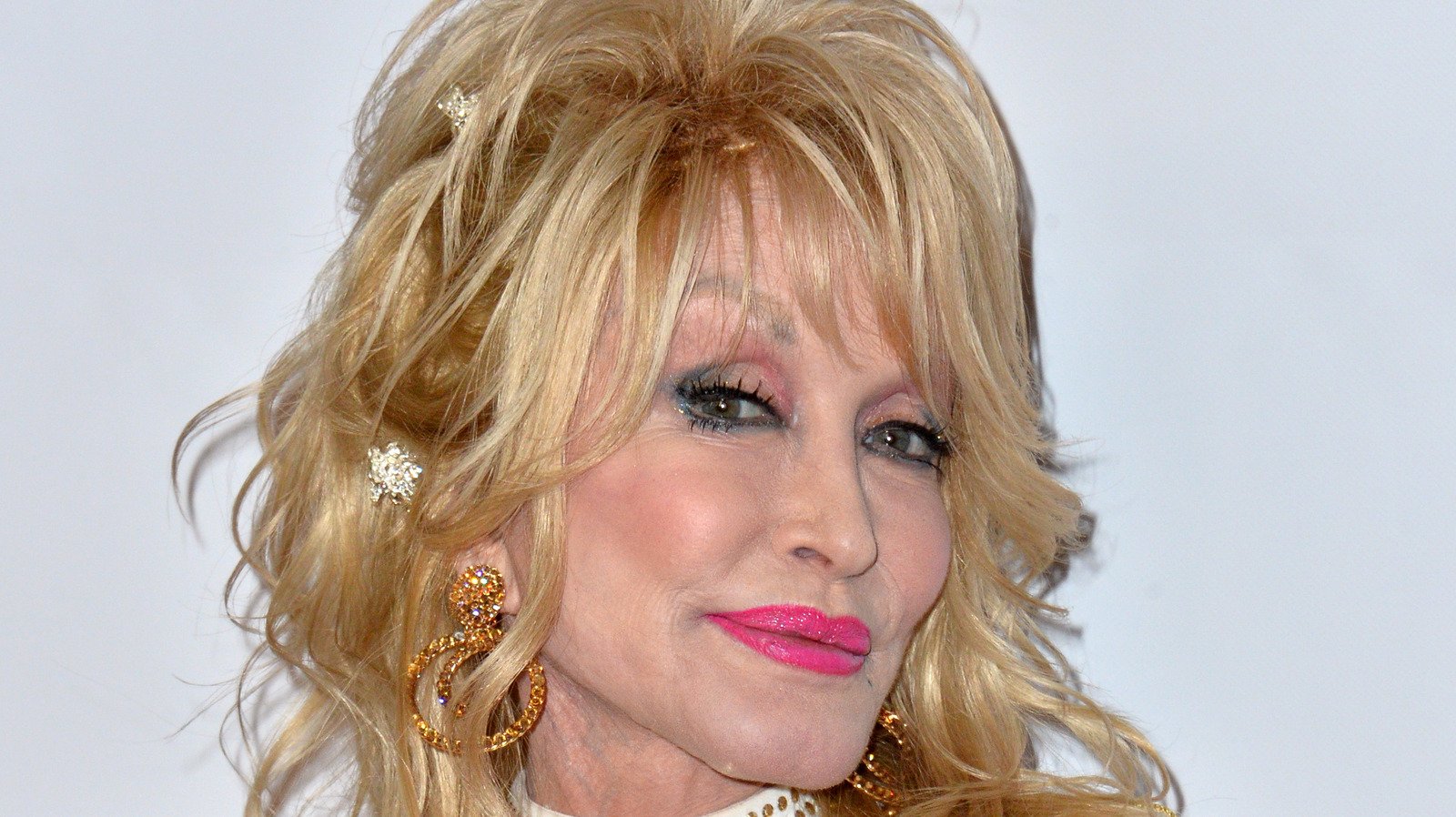 Why Dolly Parton Wears Long Sleeves All The Time