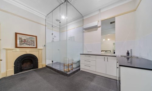 Glass act: critics see right through Adelaide rental with bathroom ‘cube’ built next to kitchen