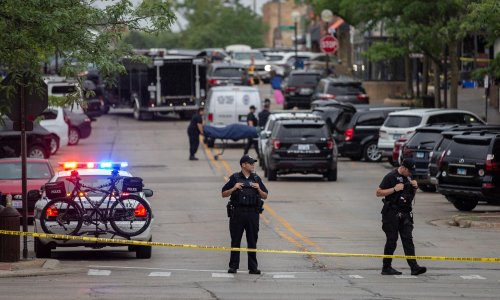 Chicago mass shooting: man in custody after six shot dead at Fourth of July parade