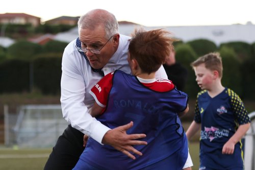 ‘Please tell me he hasn’t gone to hospital’: Morrison the bulldozer knocks over child while playing soccer