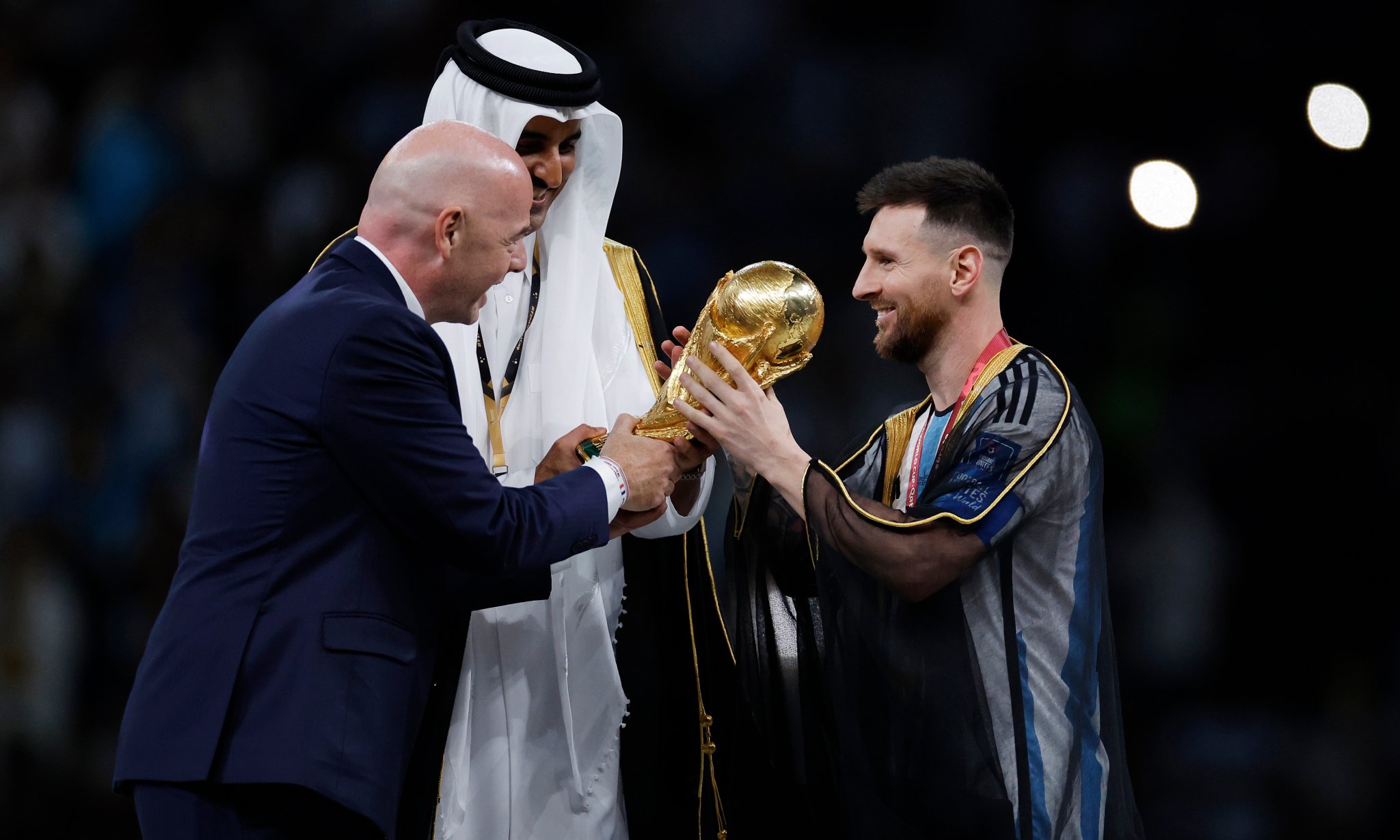 Mixed reaction as Lionel Messi draped in Arab cloak before lifting World Cup