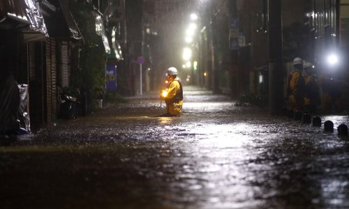 Japan's PM pledges to act after homeless men denied typhoon refuge