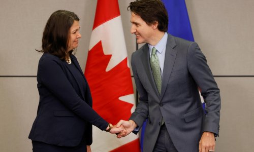 Canada’s Justin Trudeau greets political opponent with awkward handshake
