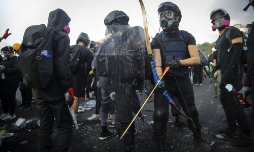 Hong Kong in chaos as protesters gather at universities with bows and arrows