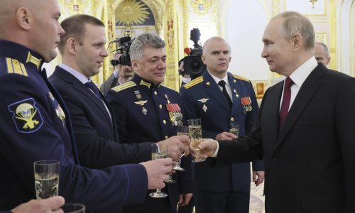 Putin vows to keep shelling Ukraine’s power grid at ‘heroes’ drinks reception
