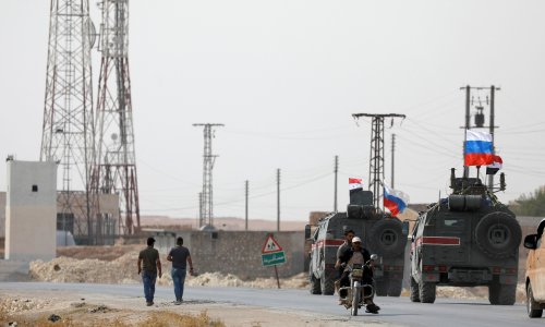 Russian troops patrol between Turkish and Syrian forces on border