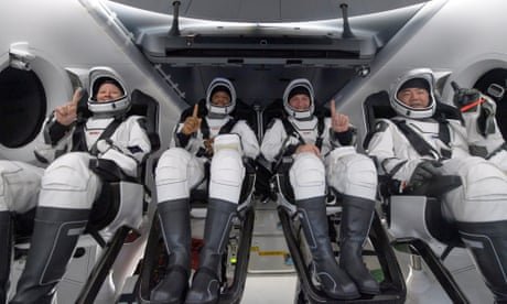 SpaceX returns four astronauts to Earth in darkness