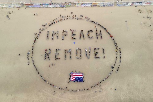 Photos: Hundreds of S.F. protesters form human banner to spell out defiance to Trump