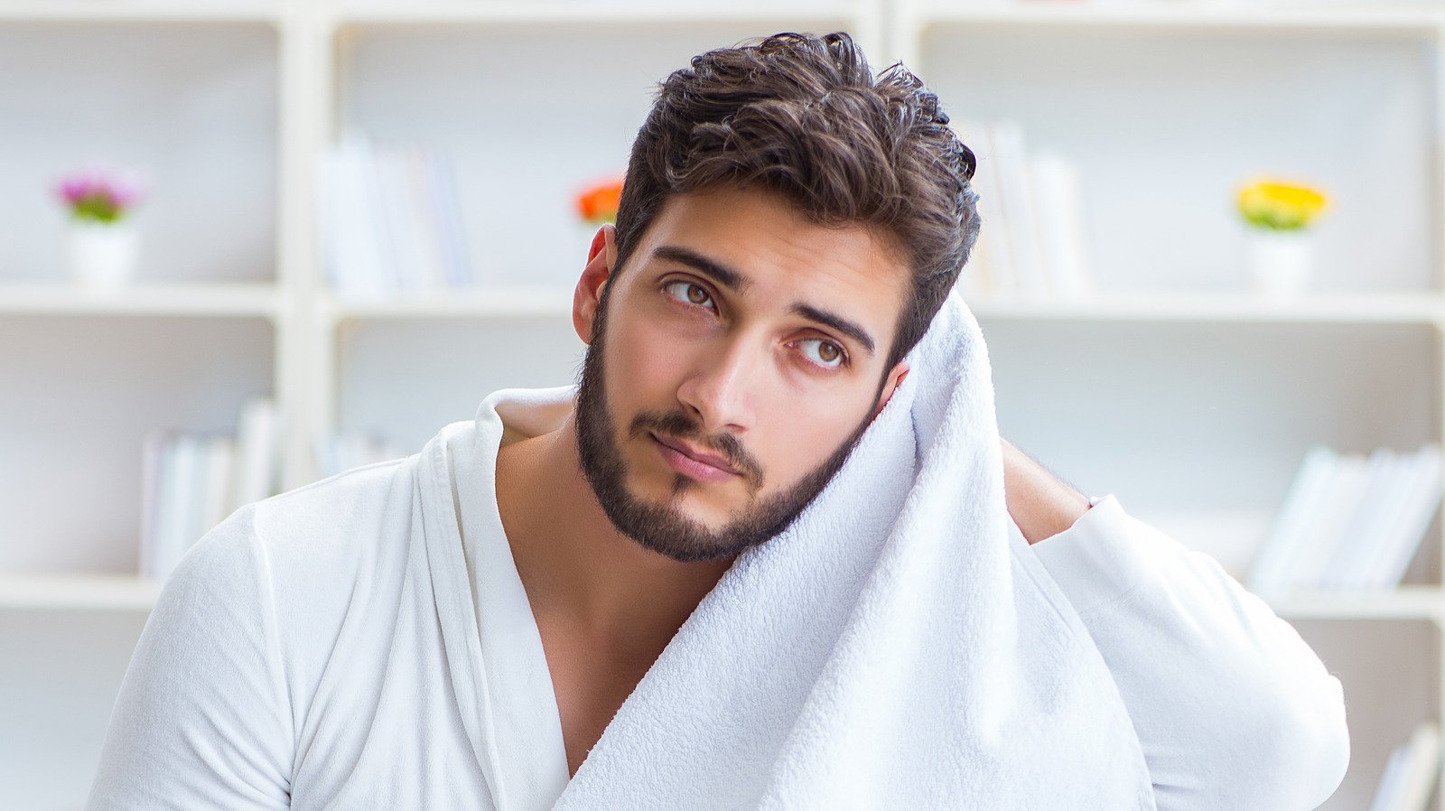 The Real Reason You Shouldn't Use A Towel To Dry Your Hair