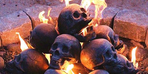 These Skull Logs Will Turn Your Fire Pit Into a Spooky Centerpiece This Halloween
